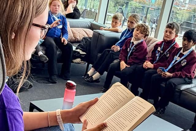 UON student teacher reads a passage from her favourite book to pass on her passion for reading to Northants primary school children.