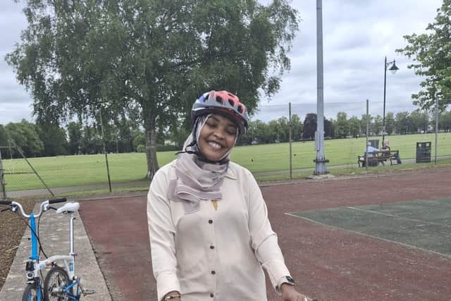 A participant enjoying riding her bike.