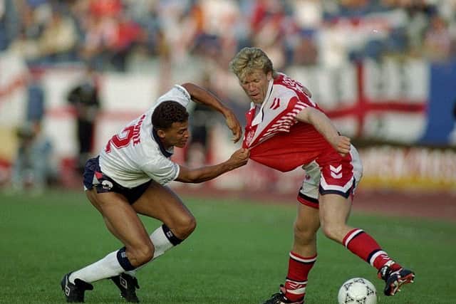Keith Curle grabs Henrik Anderson's shirt while playing for England in 1992