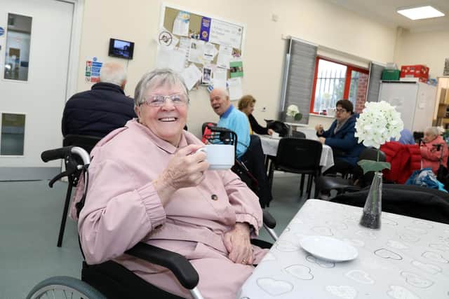 Margaret Mair enjoying a cup of tea.