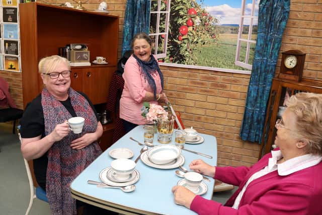 Members enjoying a hot drink in the 1950's memory corner.