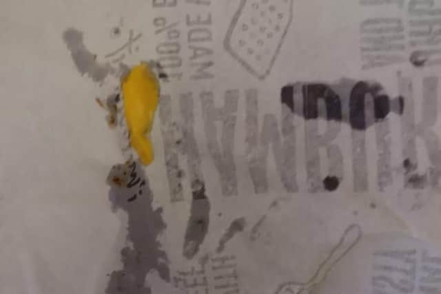 The wrapper Brooke Millar's burger was served in, with some leftover cheese