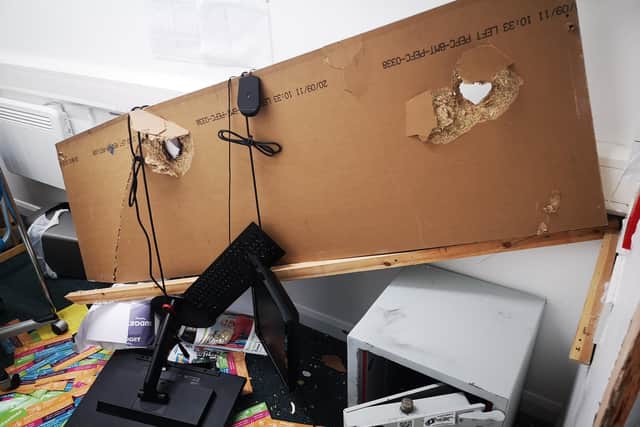 The burglar ripped a computer desk off its brackets before they left. They were unable to take any cash or goods.