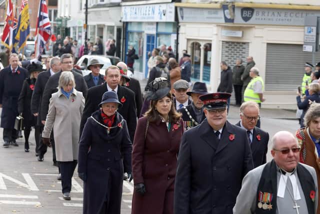 Cllr Marks (in flat cap) marched alongside Philip Hollobone at Sunday's Remembrance Parade.