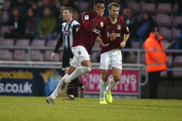 Vadaine Oliver celebrate scoring the Cobblers' second goal