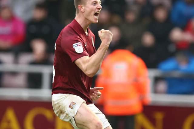 Scott Wharton shows his delight after scoring the Cobblers' first goal