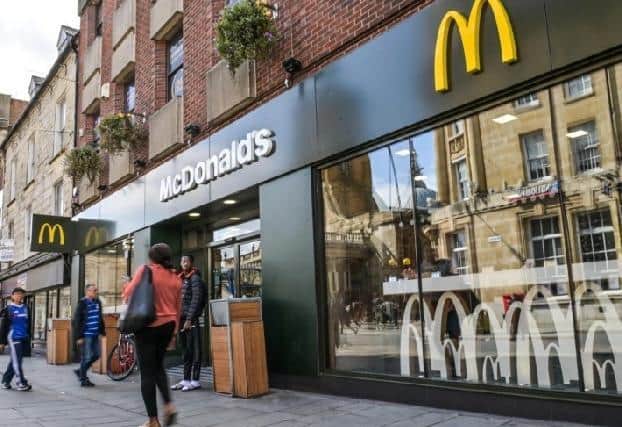 A 17-year-old boy was stabbed in the back in a gang-related fight outside the McDonald's in the Drapery.