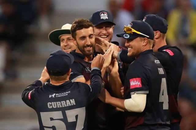 Ben Sanderson is mobbed after taking a wicket in a T20 win over Birmingham Bears