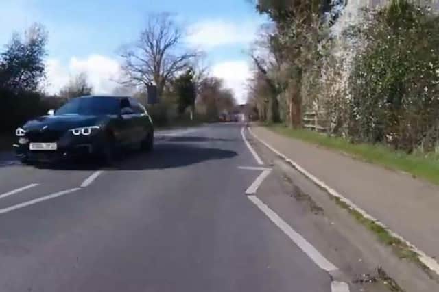 A driver was filmed passing a cyclist at 90mph