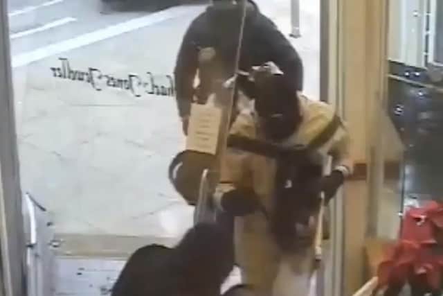 This is the moment five armed men piled into Michael Jones Jewellers in a bid to steal thousands of pounds of jewellery and watches.