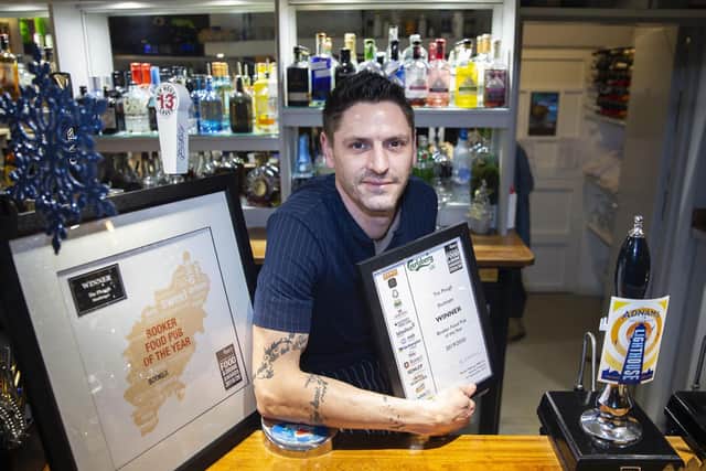 The Plough at Shutlanger landlord Jim Kay with the Northamptonshire Food and Drink Awards 2019/20 Booker Food Pub of the Year award