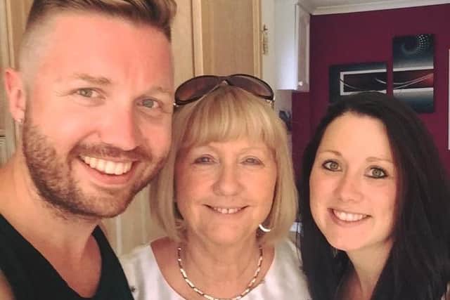 Marion (centre) with her son Gary and daughter Toni
