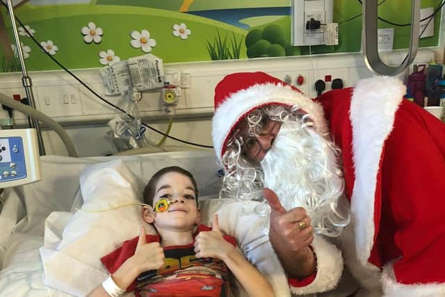 Alfie pictured with Santa at the Queens Medical Centre.