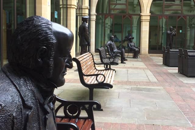 The statue of John Clare and others in the courtyard at The Guildhall
