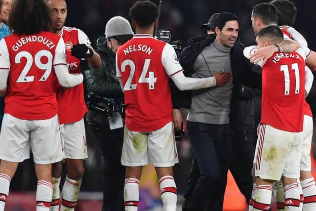 Mikel Arteta celebrates with his players after Arsenal's recent win over Manchester United