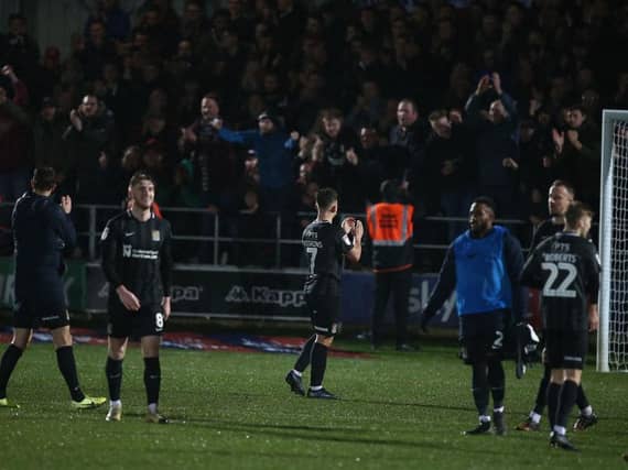 Cobblers players show their appreciation to the 1,000 plus fans that travelled all the way up to Salford on Saturday. Pictures: Pete Norton