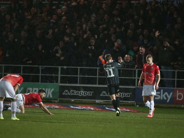 Andy Williams celebrates firing the Cobblers 2-1 ahead