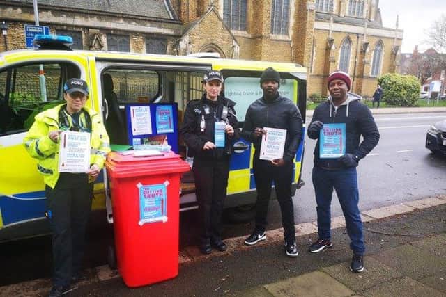 Members of the St Crispin Neighbourhood Policing Team with the knife amnesty bin.