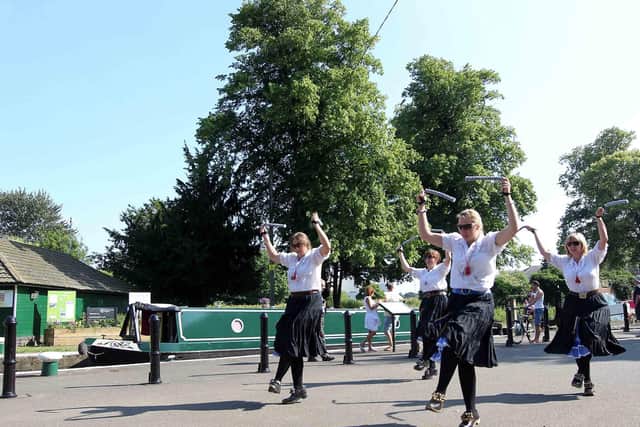Morris dancers beside the River Nene in Northampton