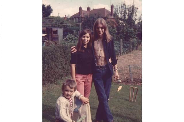 (L-R) Siblings Andy, Linda and Ron Johnson in their garden in 1971