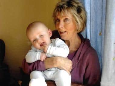 Vicky with one of her grandchildren.