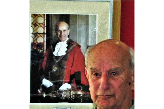 Ron pictured with his official mayor's portrait at his 90th birthday.
