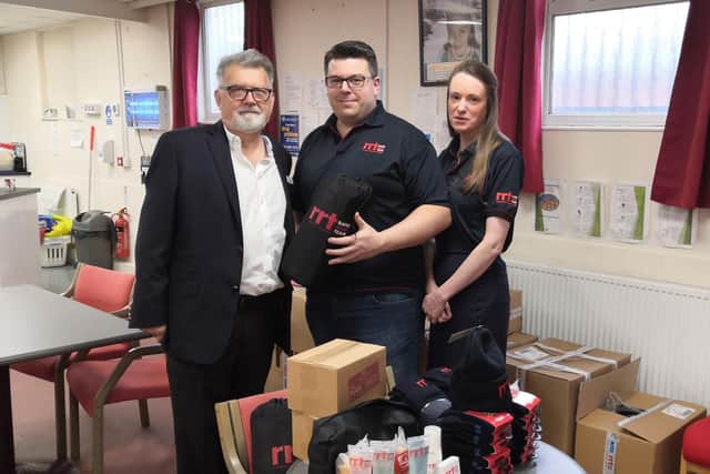 Councillor Stephen Hibbert, RRT Northampton area team leader Gareth Dixon and Gareths wife Annette Dixon at the handover.