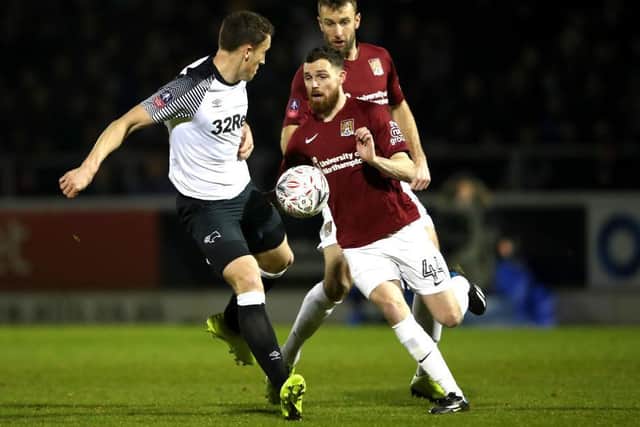 Paul Anderson battles for the ball