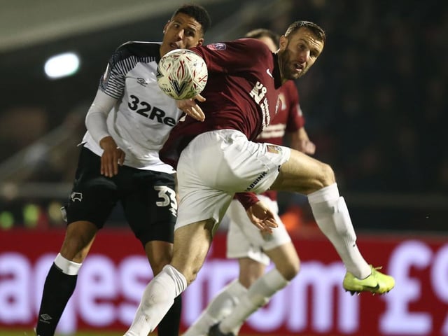 Andy Williams is closely marked by Curtis Davies