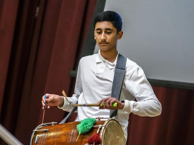 A drummer from Northampton Punjabi School perform at the Holocaust Memorial Day service