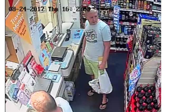 A CCTV image of Bieska at a post office waiting to ship his painkillers through Royal Mail.