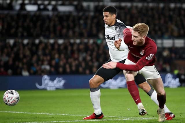 Ryan Watson tussles with Derby's Curtis Davies(Picture: Mark Thompson)