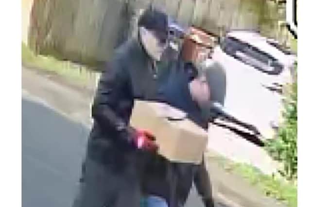 Police want to question these two men after a 92-year-old was tied up and robbed