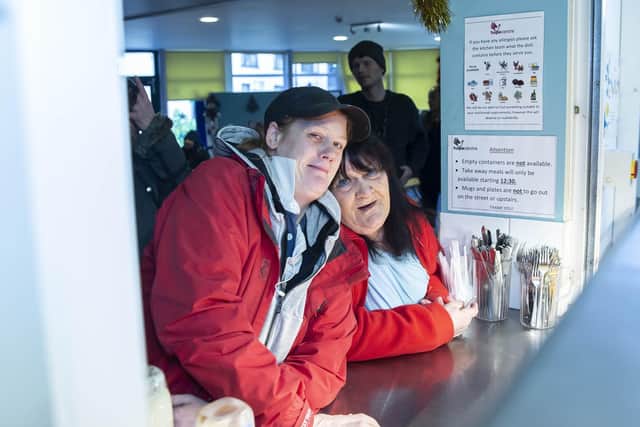 Service users waiting for their food.