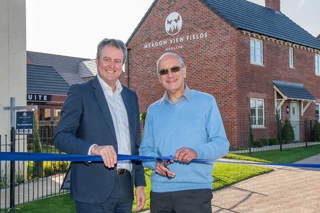Mulberry Homes managing director Ian Sadler (left) and Moulton Parish Council chairman David Aarons cut the ribbon at Meadow View Fields. Photo: Mulberry Homes