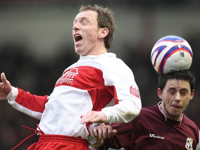 Ian Henderson gets his head to the ball