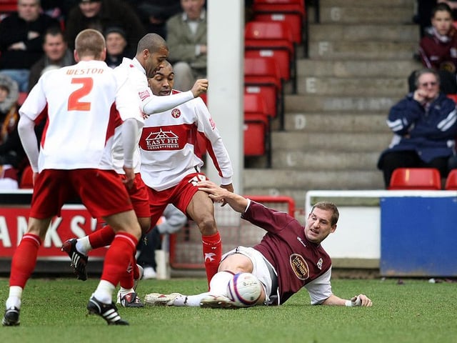 Gabor Gyepes slides in to make a tackle