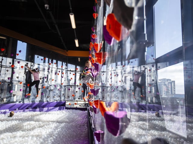 The ball pit at Gravity in Sol Central is surrounded by a climbing wall