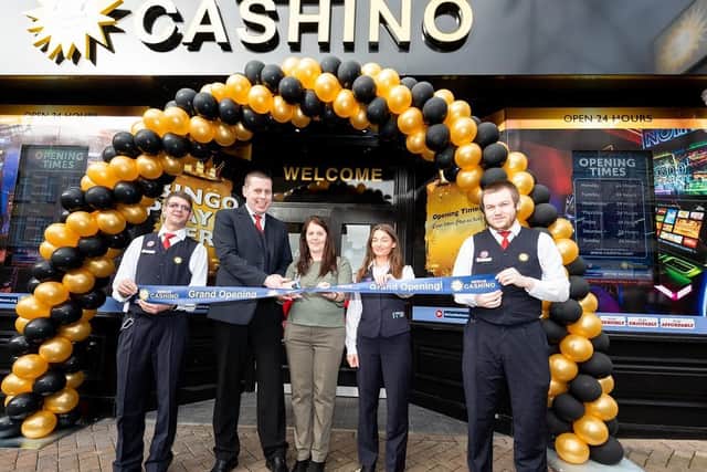 Staff cut the ribbon on the refurbishment.