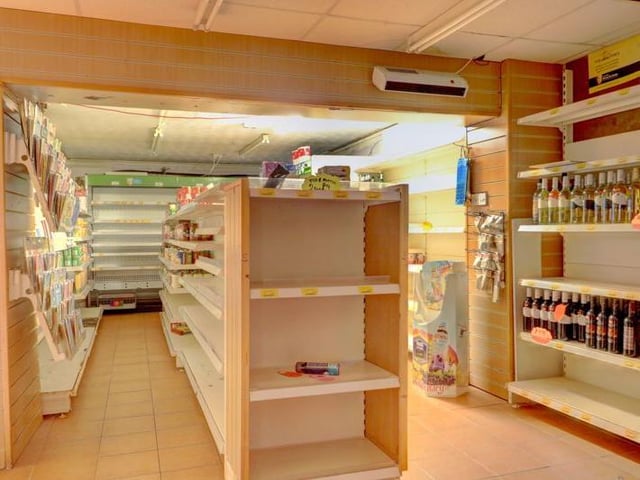 Despite being closed for several years, the listing photos show there is still stock in the old shop