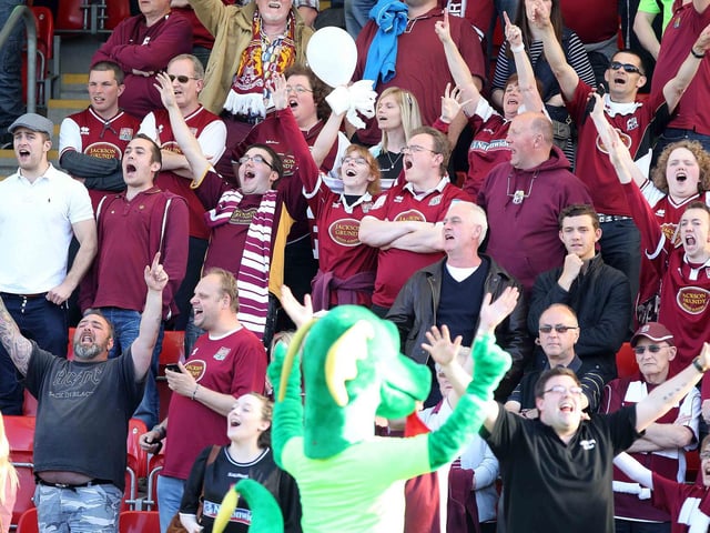 Clarence The Dragon leads the Cobblers choir