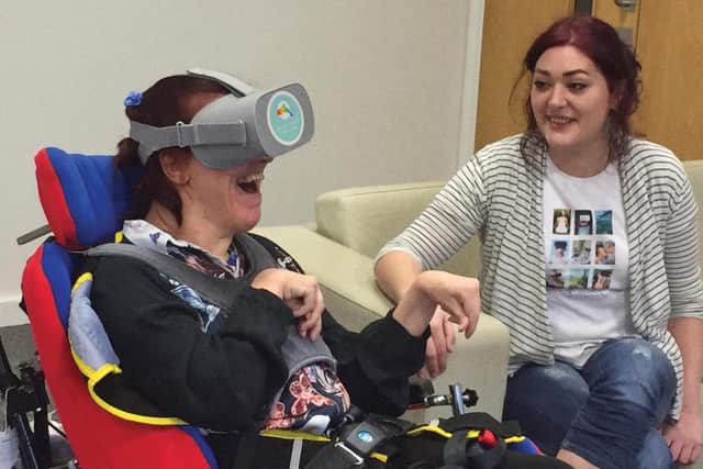 Rebecca Gill (right) pictured with a care home patient from her existing community group who uses her virtual reality therapy.
