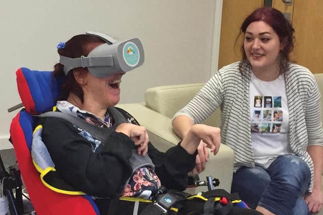 Rebecca Gill (right) pictured with a care home patient from her existing community group who uses her virtual reality therapy.