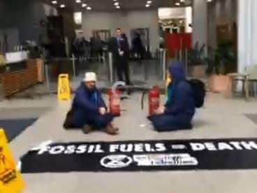 Climate change protesters make their point in the reception area