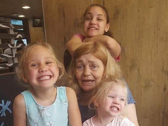 Helen with three of her grandchildren.
