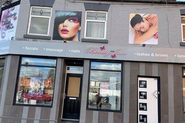 Beauty With Inn have had to put board up on its damaged door.