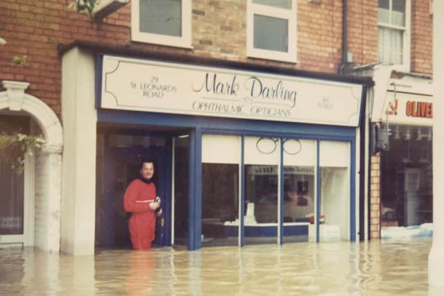 Mark Darling pictured outside his optitions shop on St Leonards Road, Far Cotton, Northampton when the shop was badly flooded in 1998.