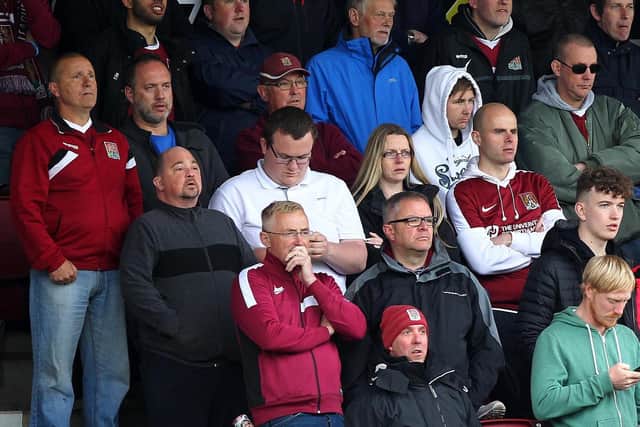 Lee Geary (left) has sat in the same seat in the north stand at Sixfields for every Cobblers game of the past 25 years