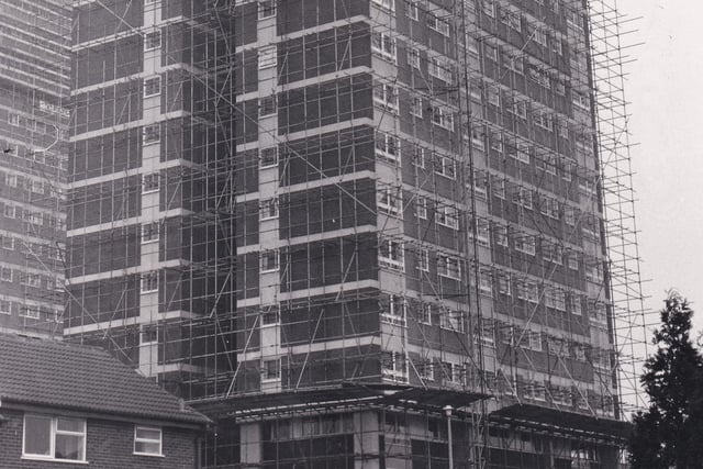 Scaffolding surrounds Gamble Hill Grange flats in Bramley.