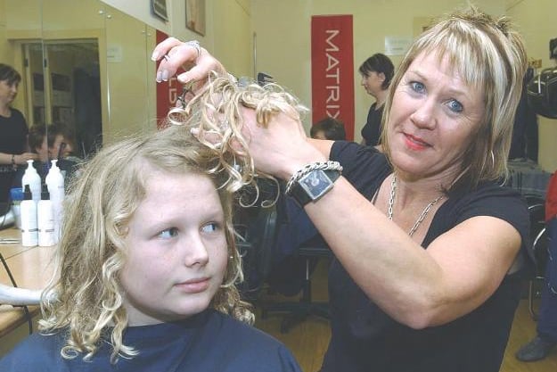 Hairdresser Linda Greatorex and Reece Caunce having his curls cut off for Red Nose Day in 2007